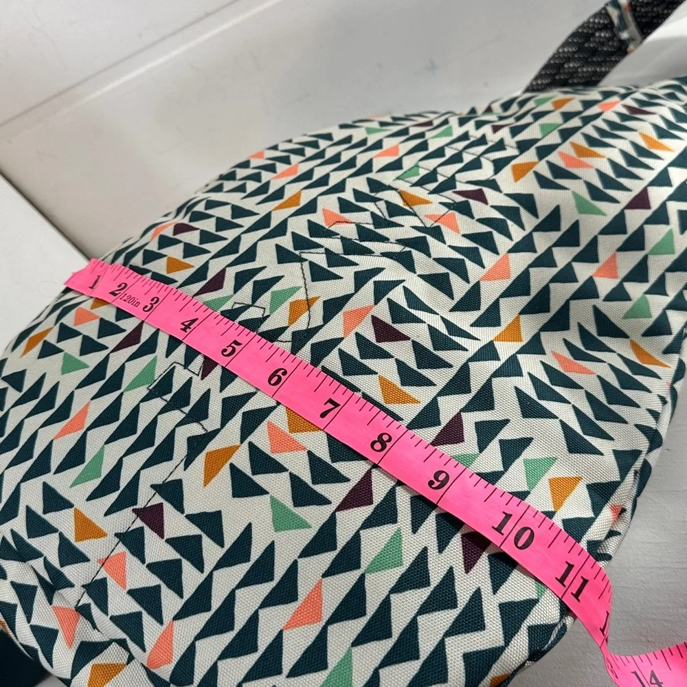 Kavu Geometric Triangle Sling Backpack in Cream, Black, Orange, Green, Navy